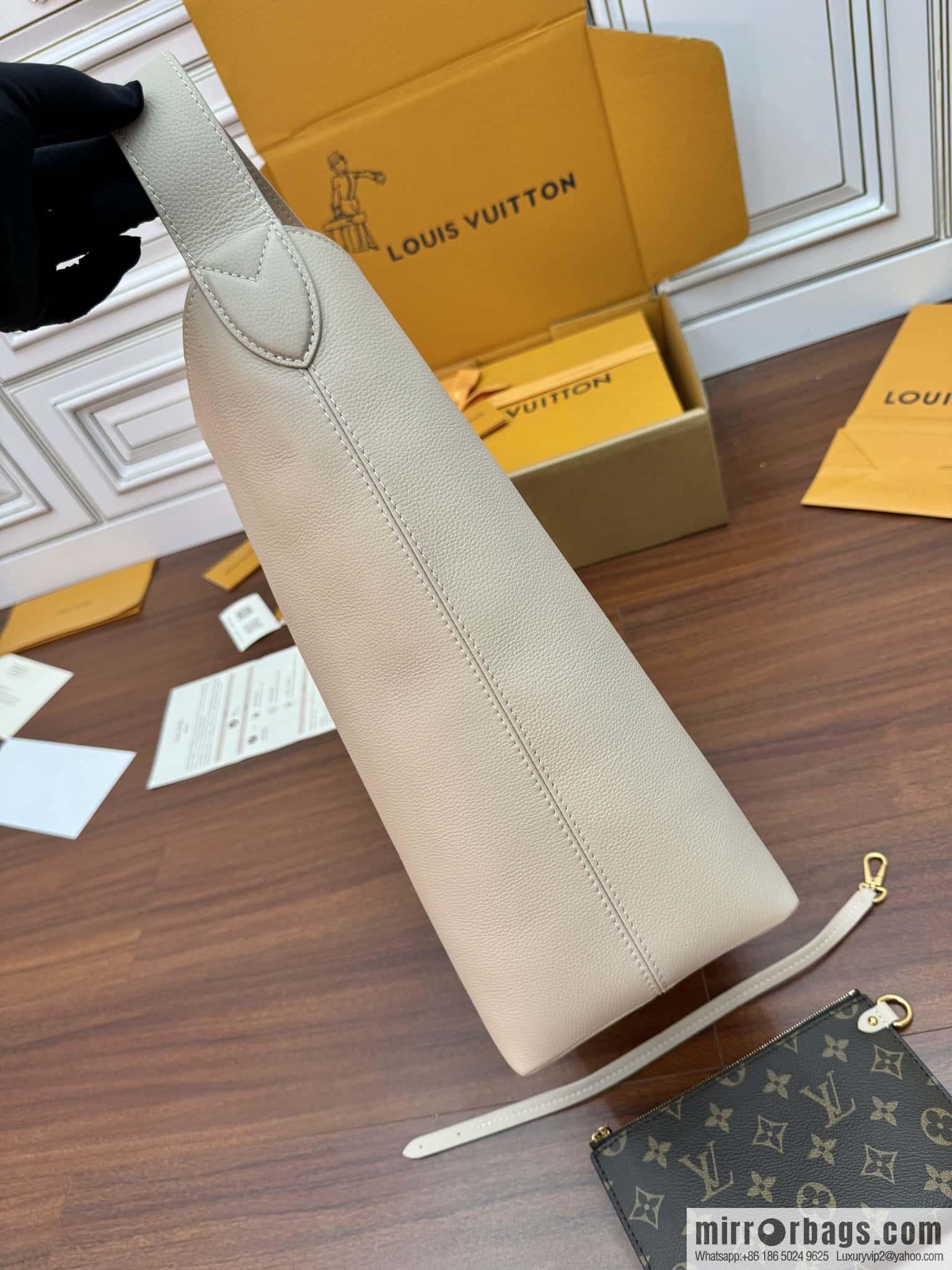 LV M25022 LOW KEY HOBO medium handbag
