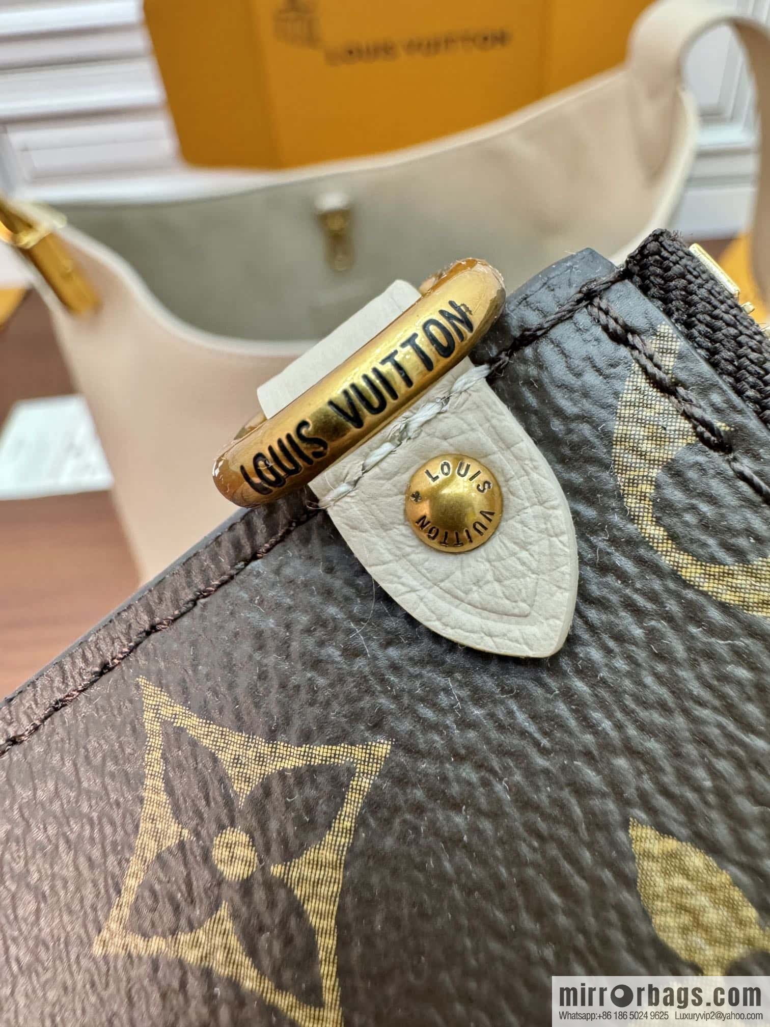 LV M25022 LOW KEY HOBO medium handbag