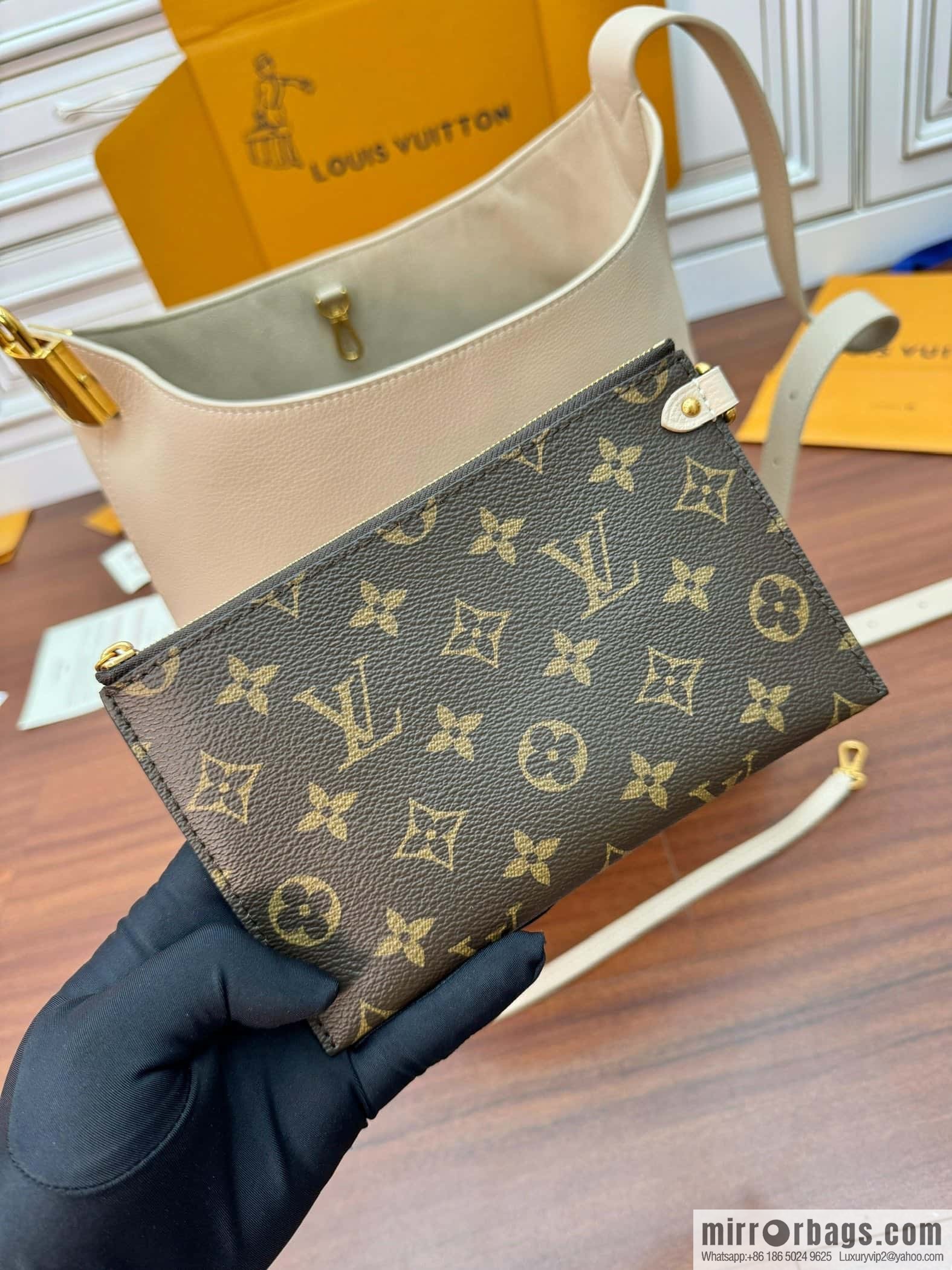 LV M25022 LOW KEY HOBO medium handbag