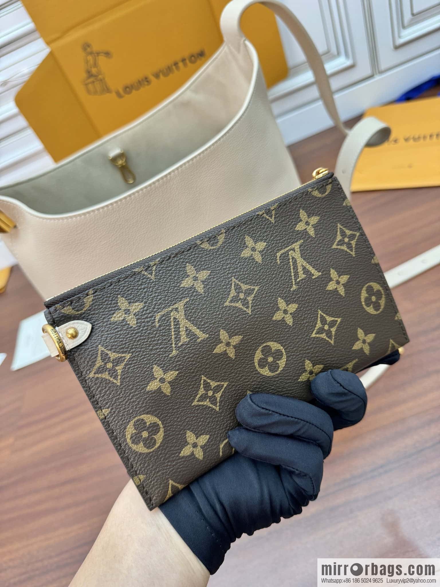 LV M25022 LOW KEY HOBO medium handbag