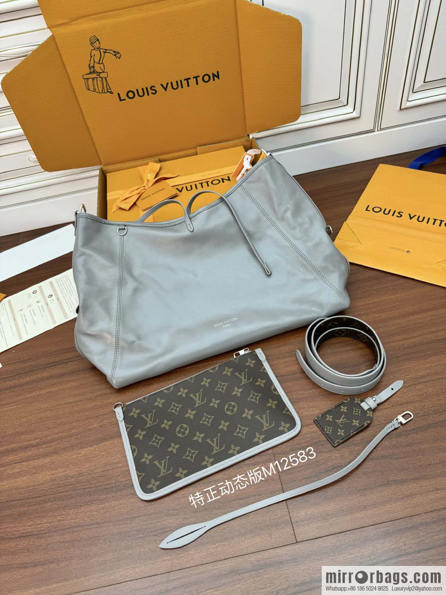 LV M12583 new CARRYALL DARK medium handbag of the season
