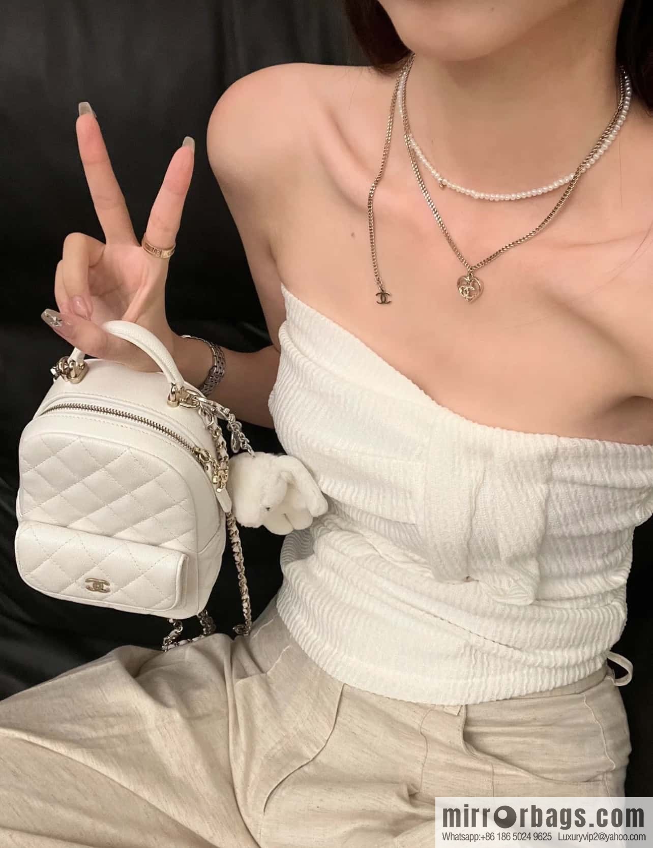Chanel 24C mini backpack, black gold genuine leather AP3753 white