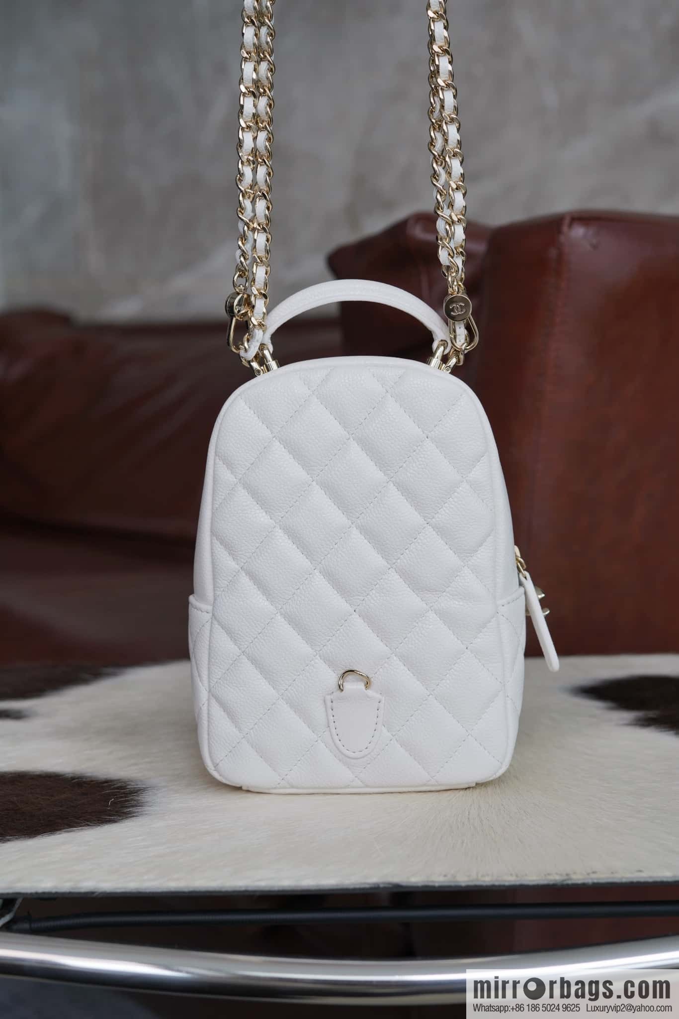 Chanel 24C mini backpack, black gold genuine leather AP3753 white