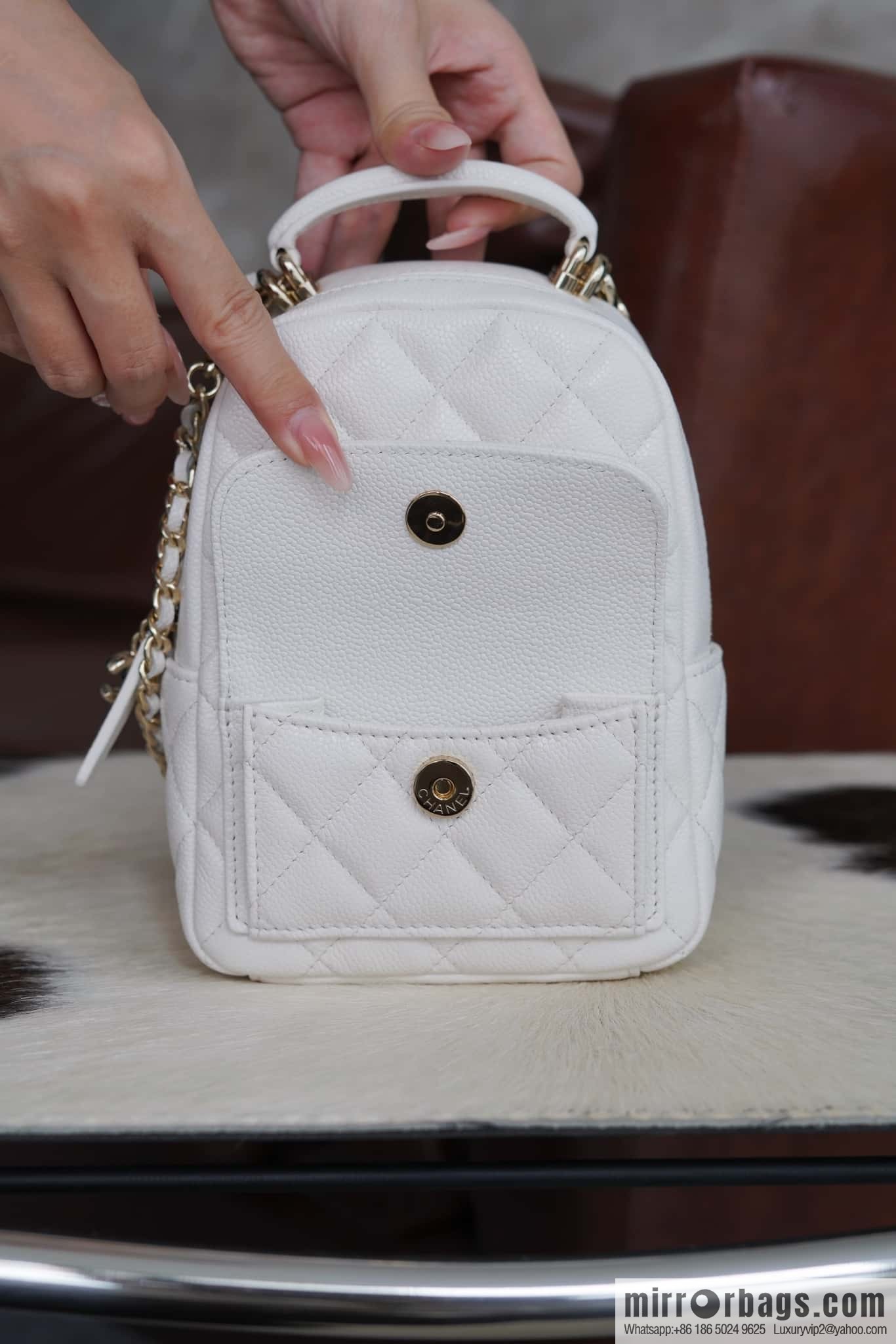 Chanel 24C mini backpack, black gold genuine leather AP3753 white