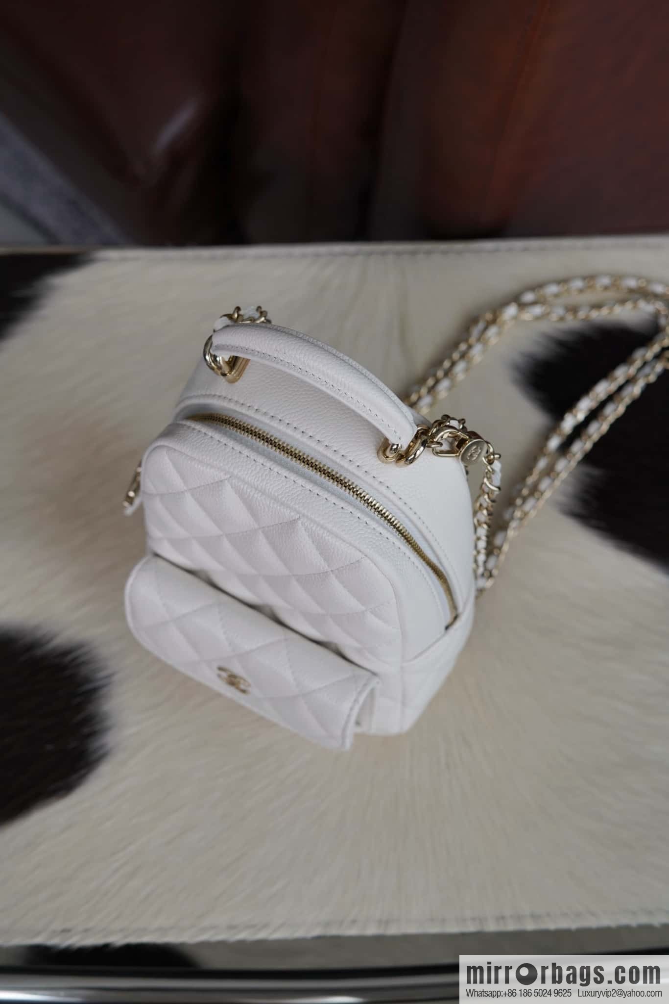 Chanel 24C mini backpack, black gold genuine leather AP3753 white
