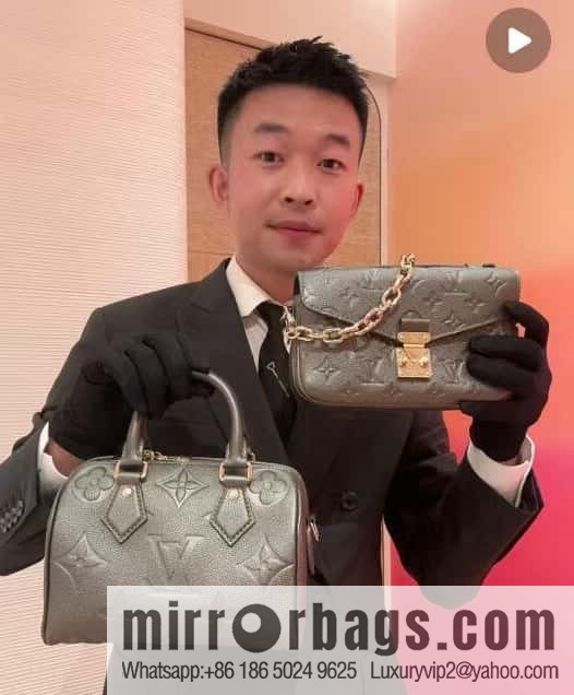 LV M11998 Pochette Métis East West