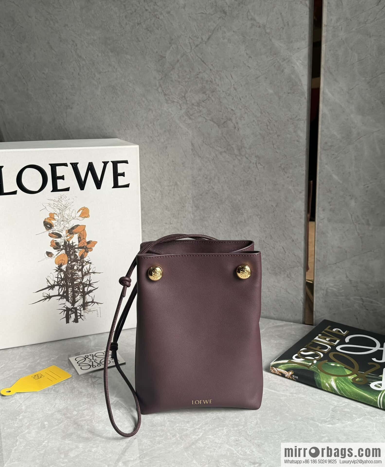 LOEWE's new Pebble Pouch 0905 burgundy
