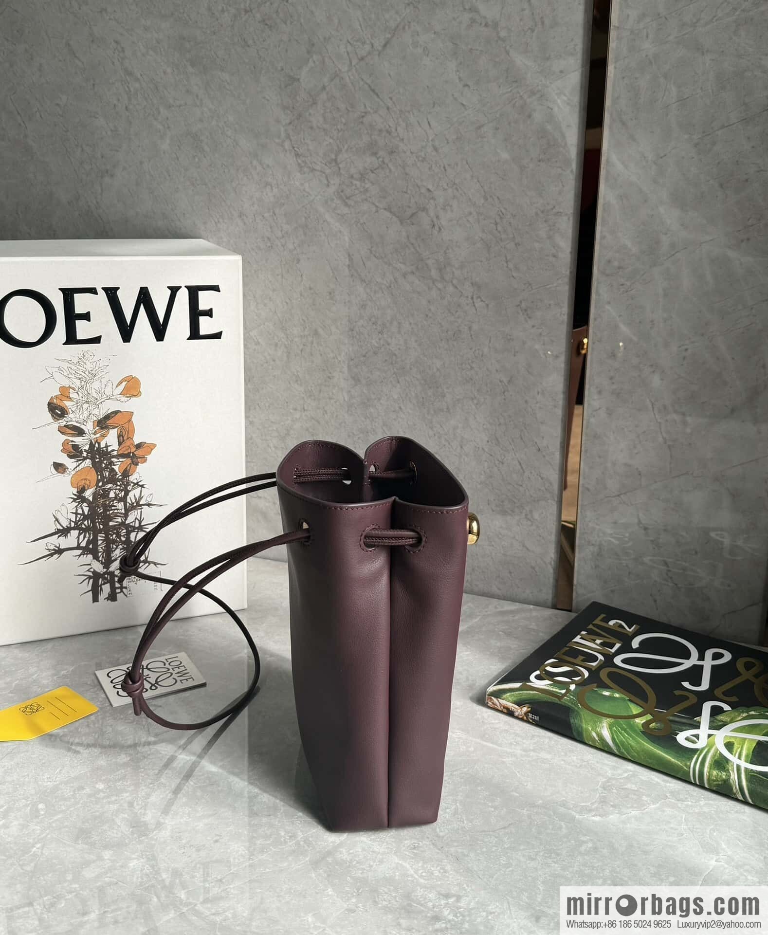 LOEWE's new Pebble Pouch 0905 burgundy
