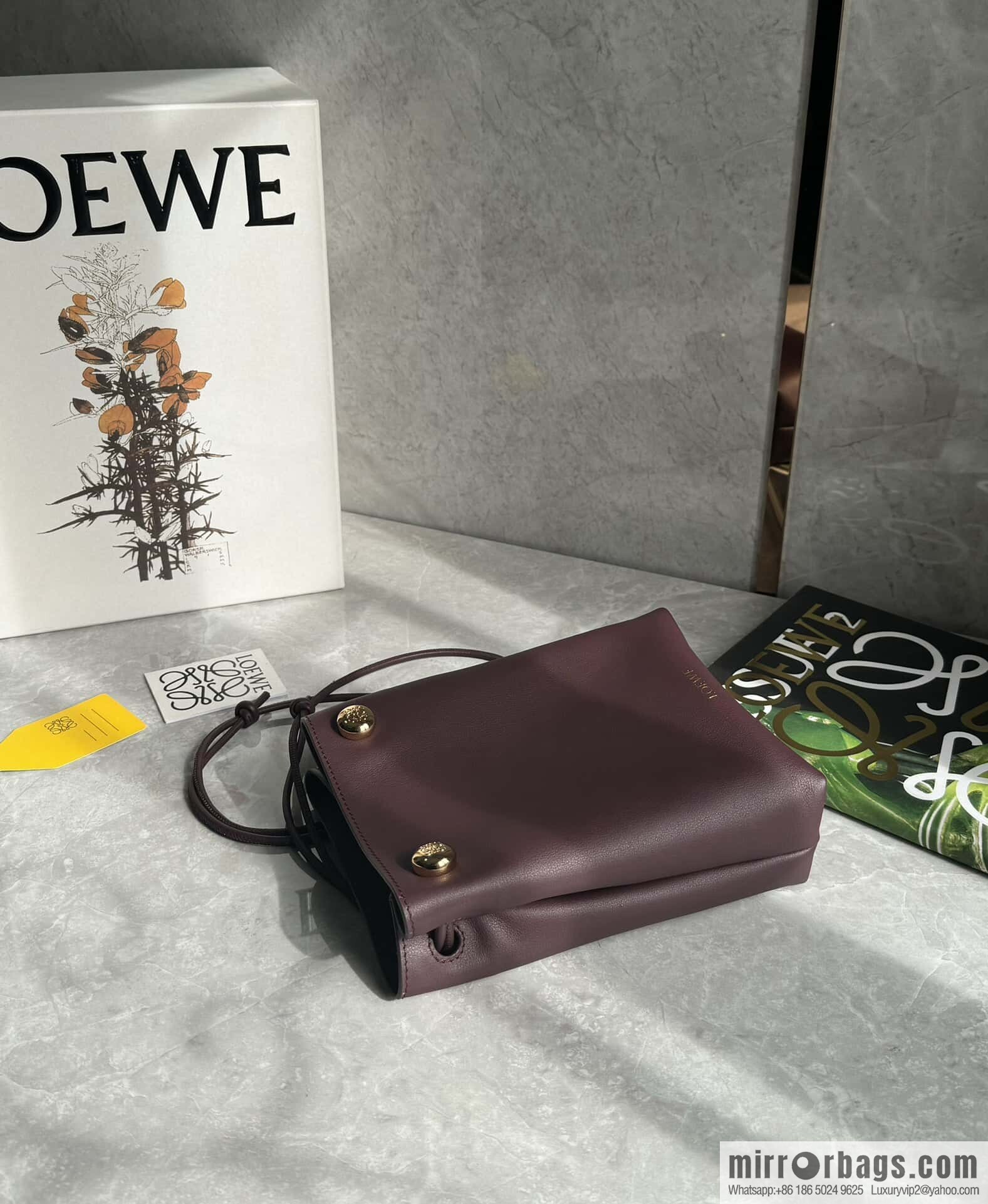 LOEWE's new Pebble Pouch 0905 burgundy