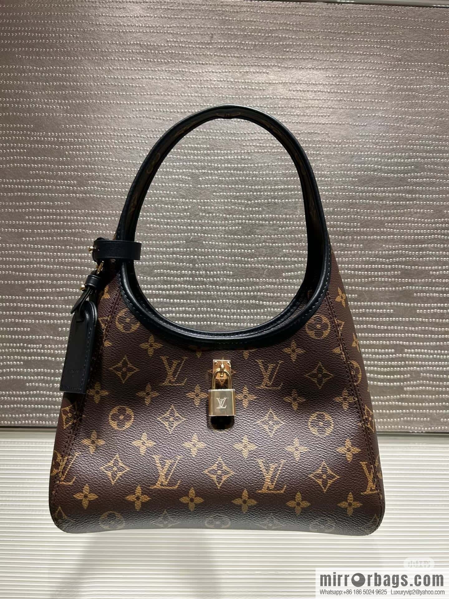 [Premium‑quality] M12940 monogram black hand carry armpit bag, the new The Drop small handbag of the season