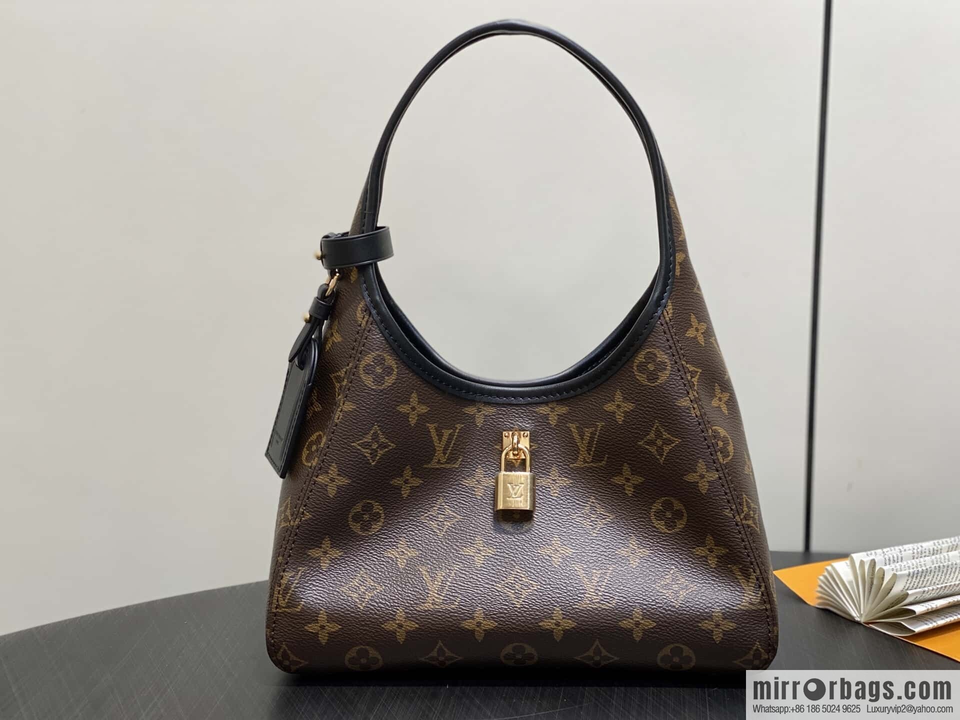 [Premium‑quality] M12940 monogram black hand carry armpit bag, the new The Drop small handbag of the season