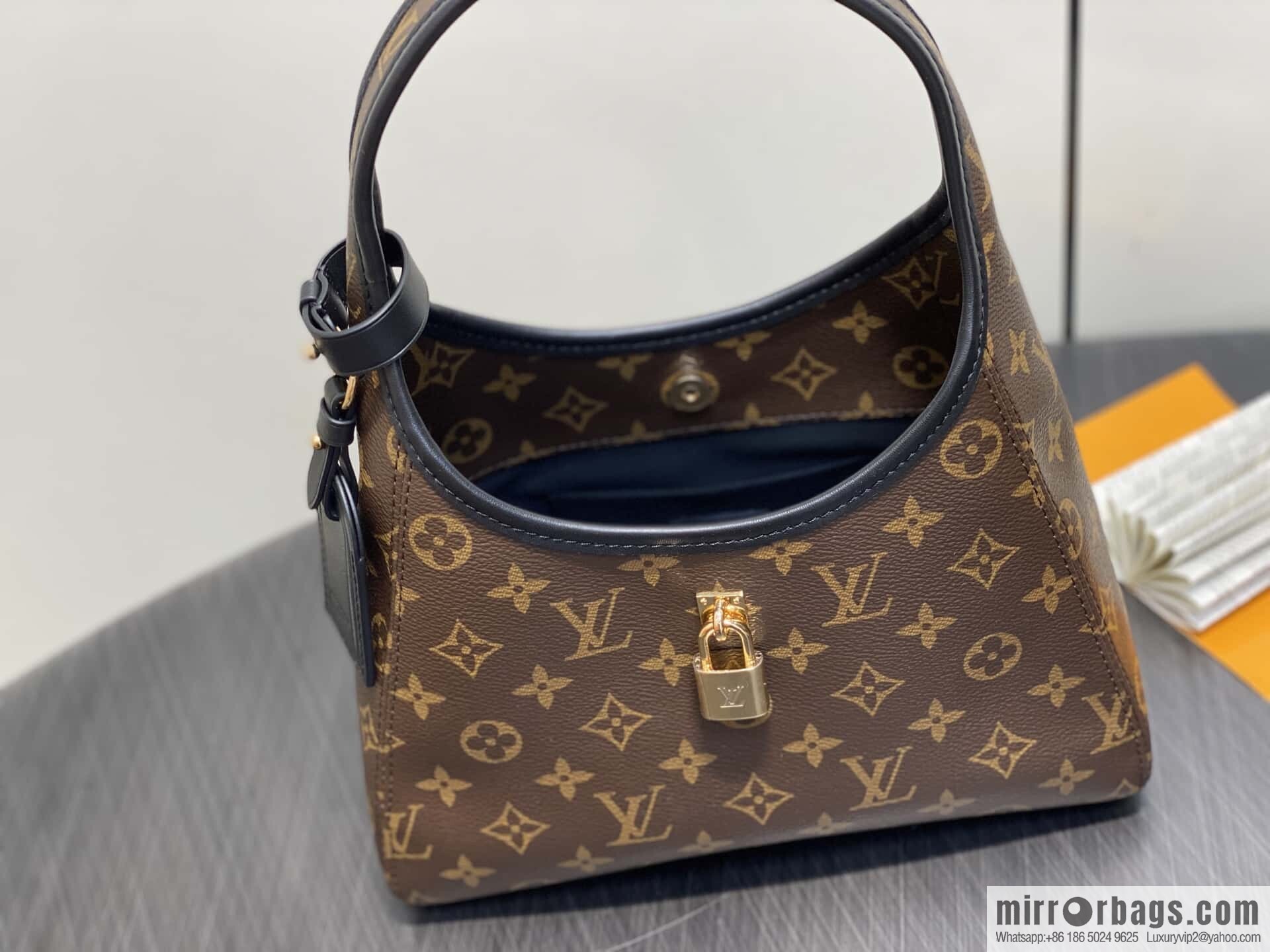 [Premium‑quality] M12940 monogram black hand carry armpit bag, the new The Drop small handbag of the season