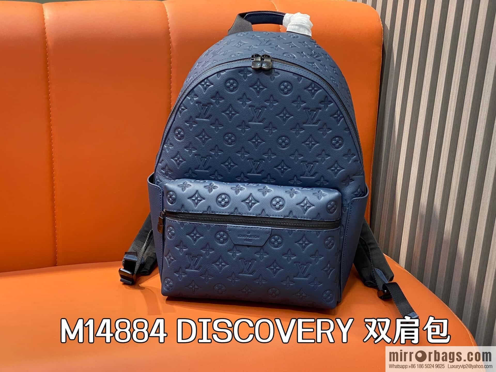 [Premium‑quality] M14884 dark blue, opposite version shoulder strap full leather embossed backpack DISCOVERY backpack