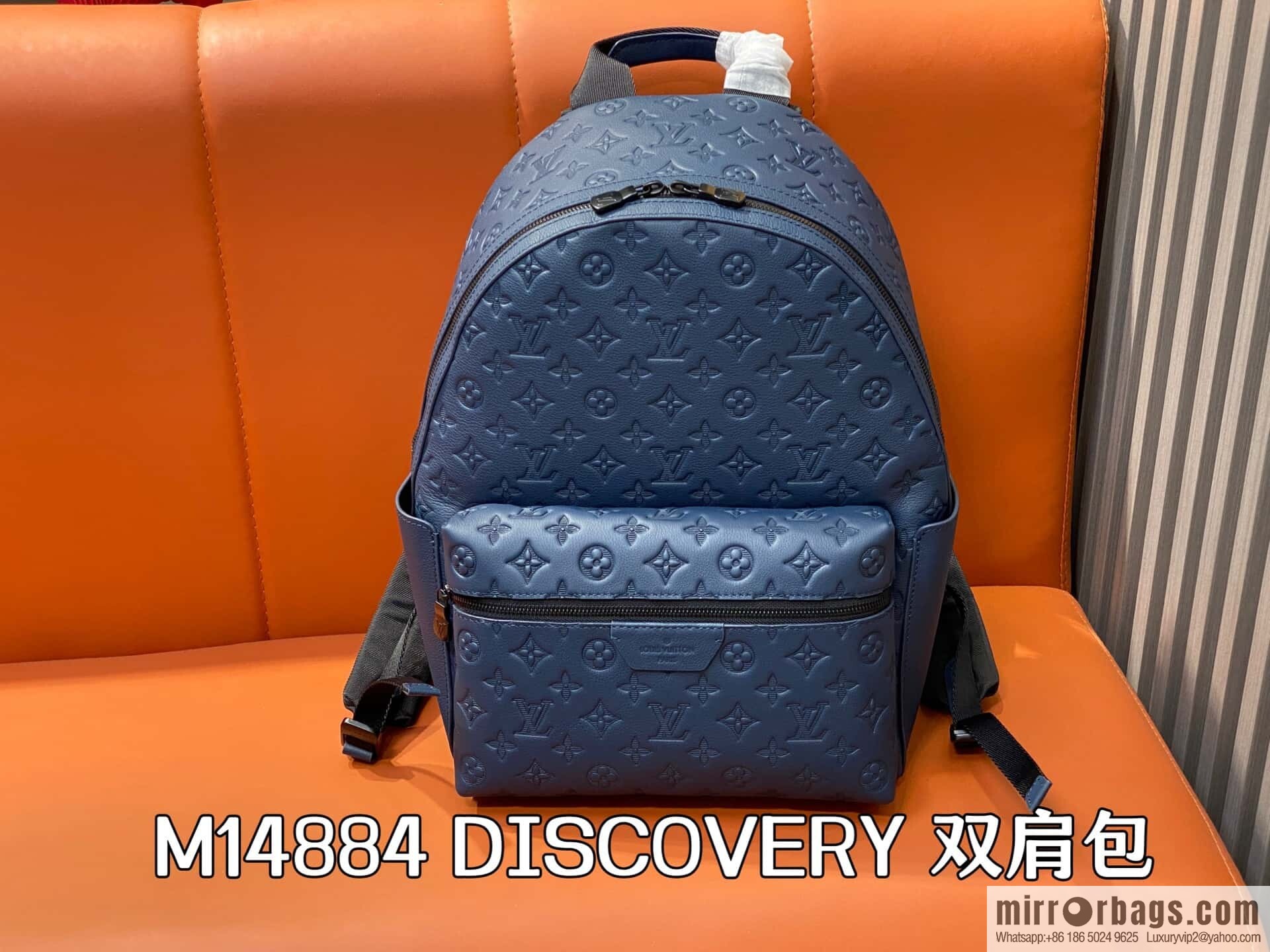 [Premium‑quality] M14884 dark blue, opposite version shoulder strap full leather embossed backpack DISCOVERY backpack