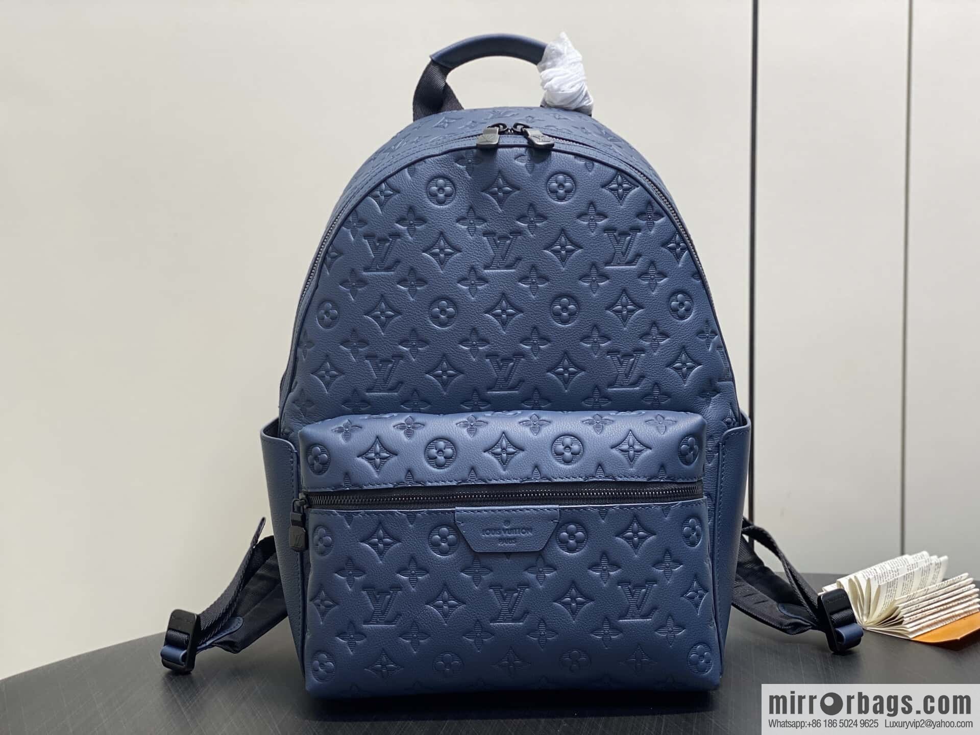 [Premium‑quality] M14884 dark blue, opposite version shoulder strap full leather embossed backpack DISCOVERY backpack