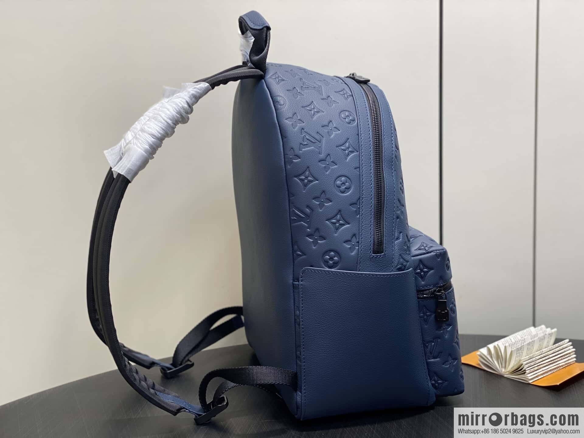 [Premium‑quality] M14884 dark blue, opposite version shoulder strap full leather embossed backpack DISCOVERY backpack