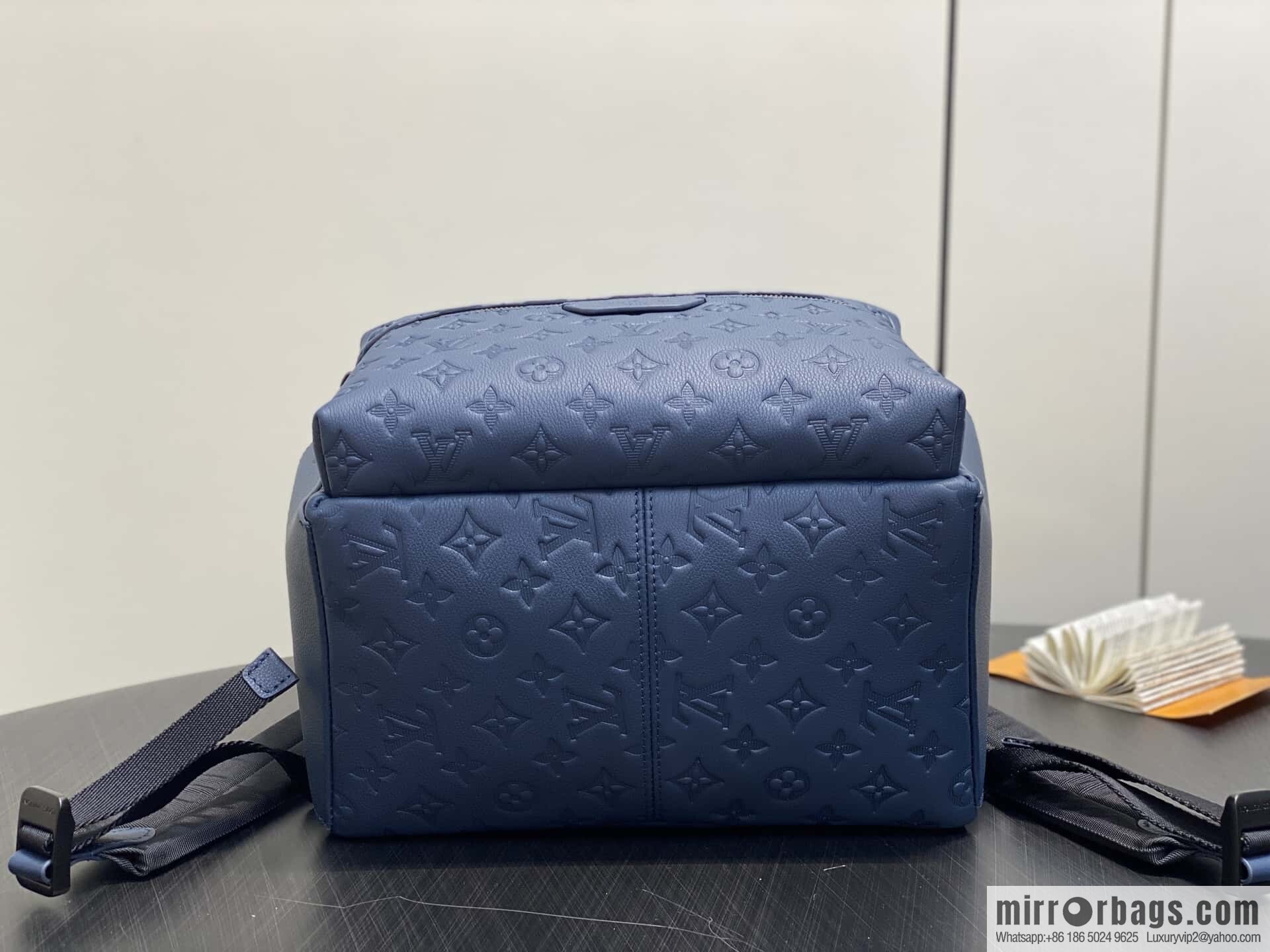 [Premium‑quality] M14884 dark blue, opposite version shoulder strap full leather embossed backpack DISCOVERY backpack