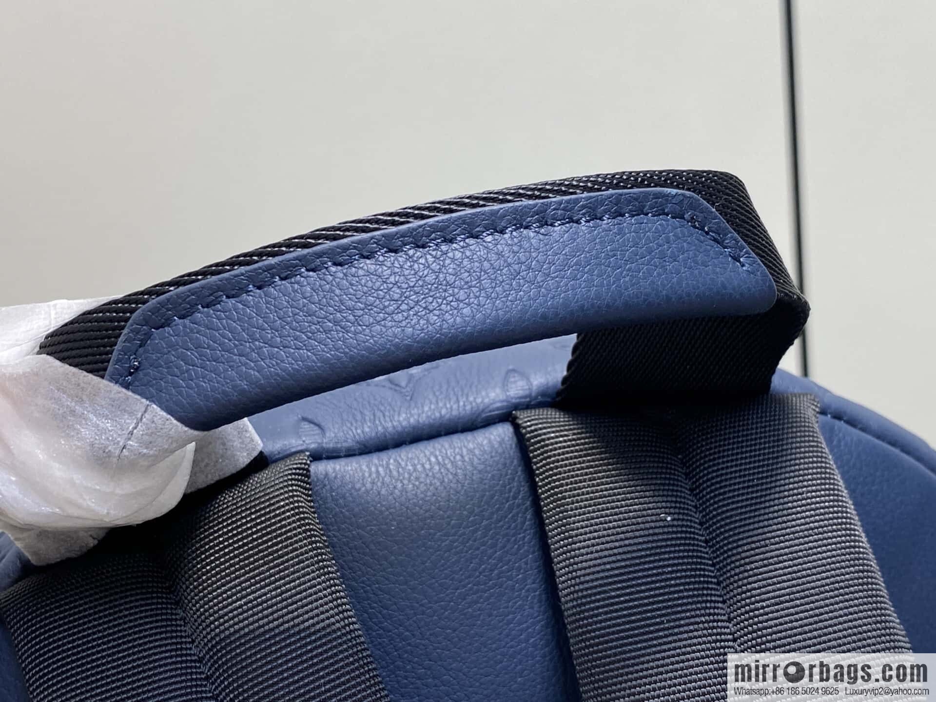 [Premium‑quality] M14884 dark blue, opposite version shoulder strap full leather embossed backpack DISCOVERY backpack