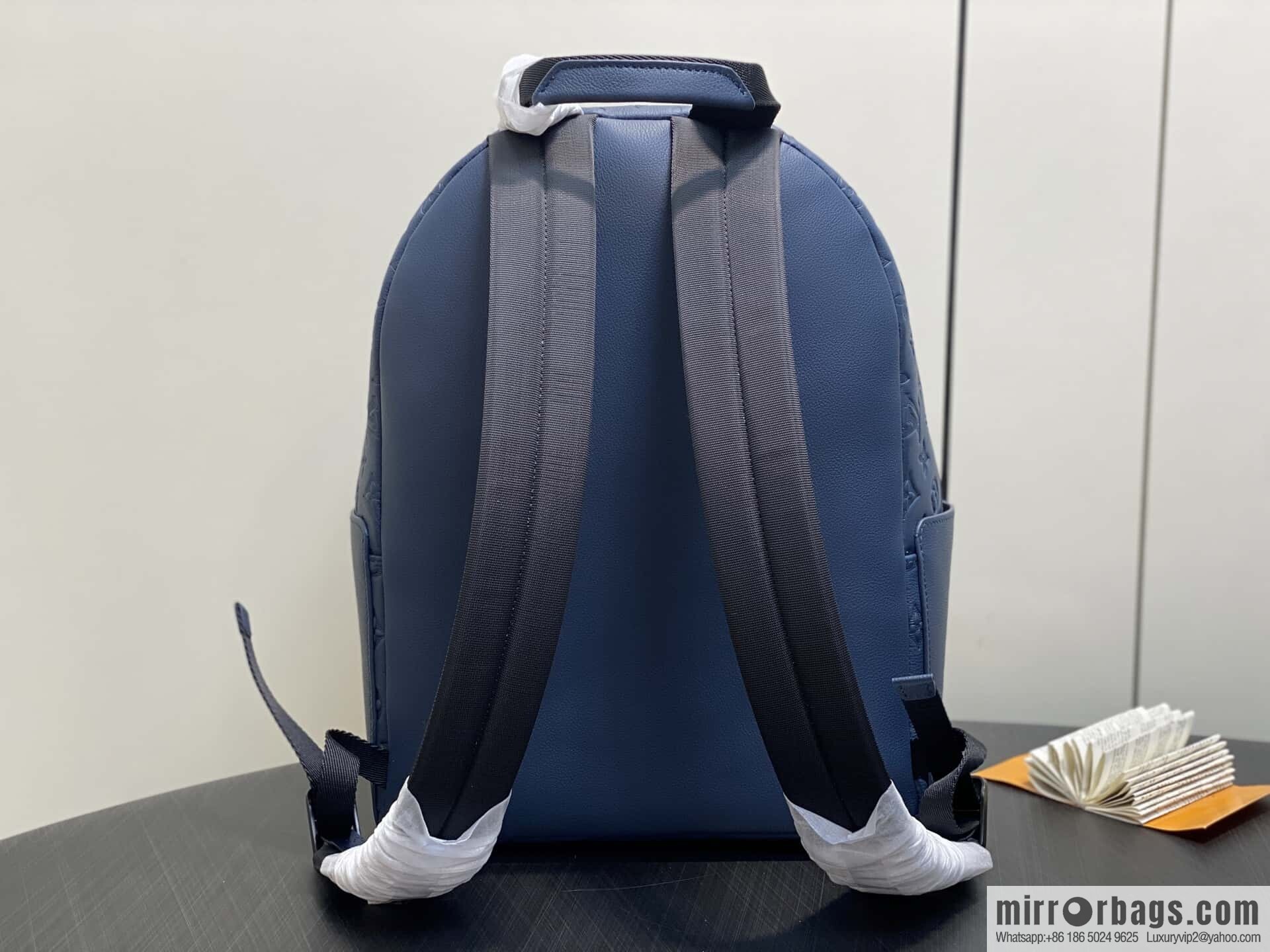 [Premium‑quality] M14884 dark blue, opposite version shoulder strap full leather embossed backpack DISCOVERY backpack