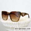 PRADA temple triangle embellished sunglasses