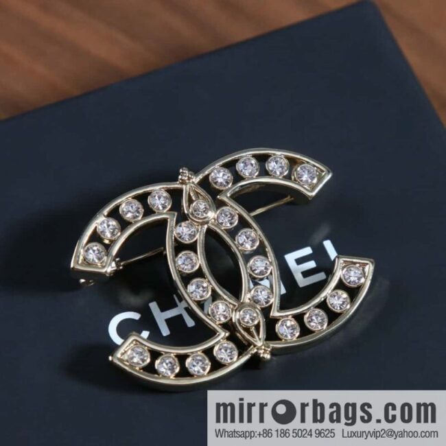 New, Chanel full diamond double c brooch.