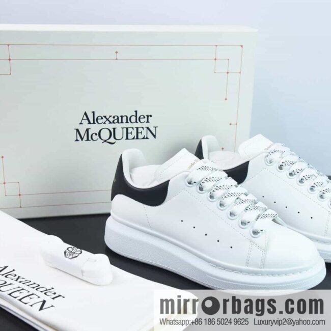 Alexander McQueen, black shiny low-top sneakers