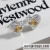 New ☑️ Vivienne Westwood Queen Mother Saturn Love Peach Heart Earrings